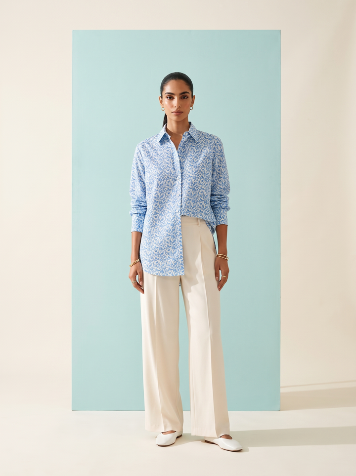 Shop this blue geometric print women’s shirt in premium cotton. A breathable and comfortable button-down style for office, travel and everyday wear.
