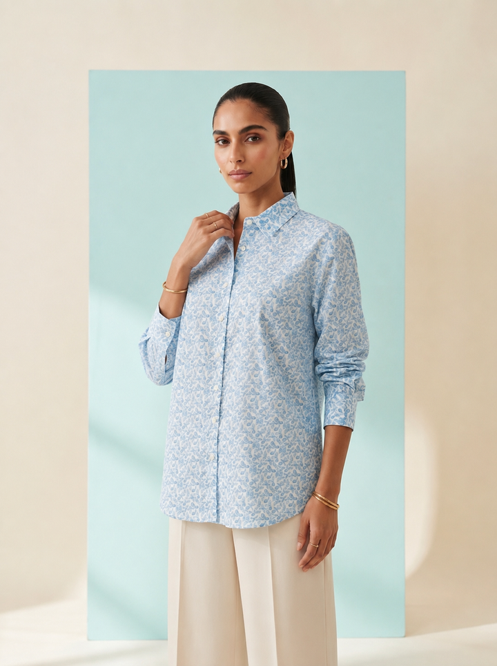 Shop this blue geometric print women’s shirt in premium cotton. A breathable and comfortable button-down style for office, travel and everyday wear.
