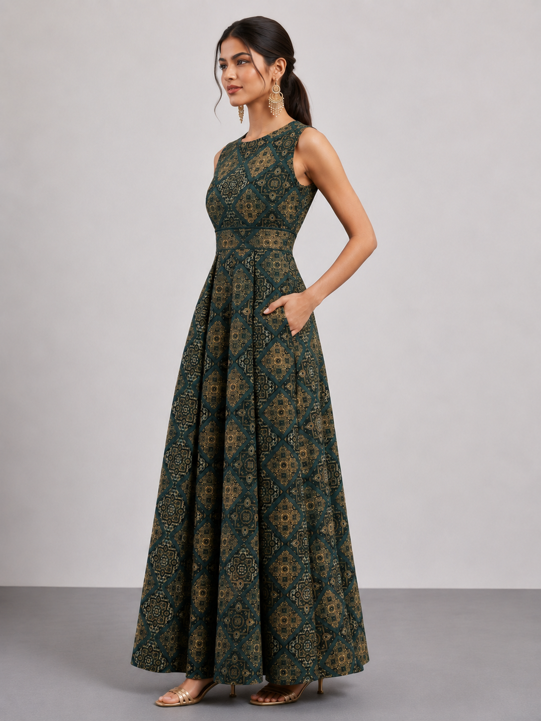 A stylish sleeveless jumpsuit crafted from premium Hydra muslin, featuring an elegant geometric print, soft texture, and a flowing drape for effortless sophistication and all-day comfort.