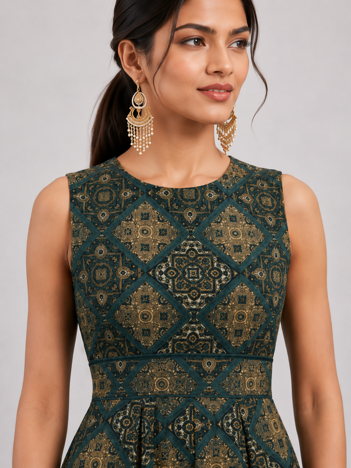 A stylish sleeveless jumpsuit crafted from premium Hydra muslin, featuring an elegant geometric print, soft texture, and a flowing drape for effortless sophistication and all-day comfort.