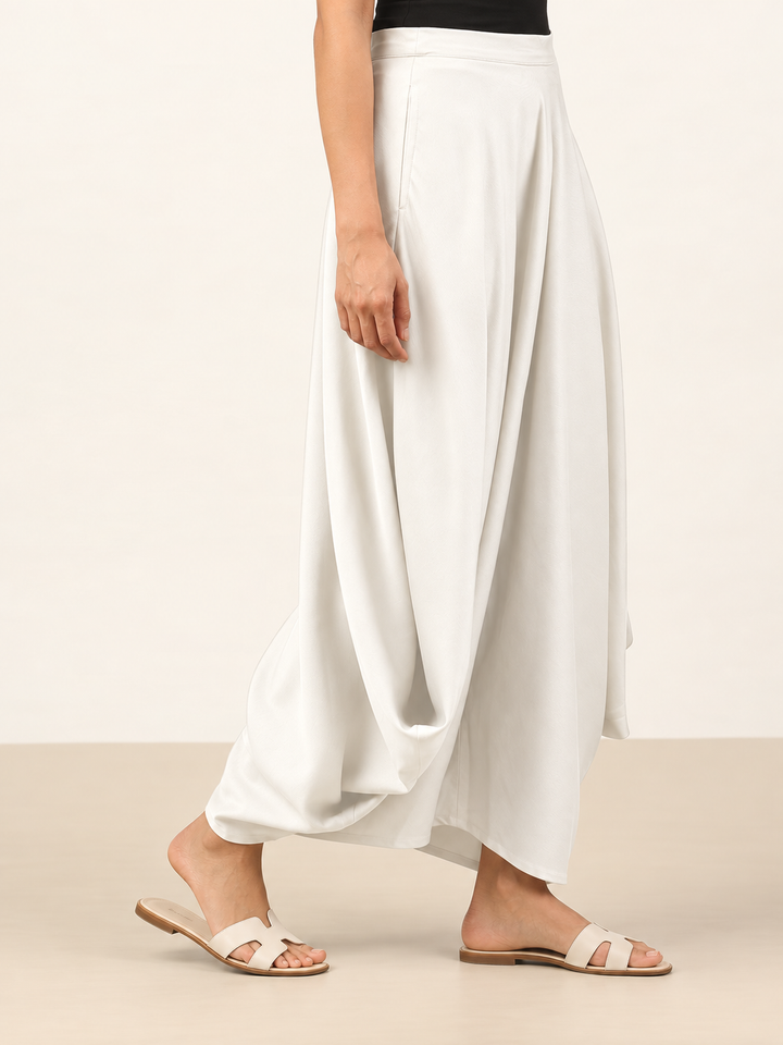 Shop ivory rayon cowl pants for women by Lush Layers. A soft, fluid draped silhouette designed for comfortable and contemporary Indo-western styling.