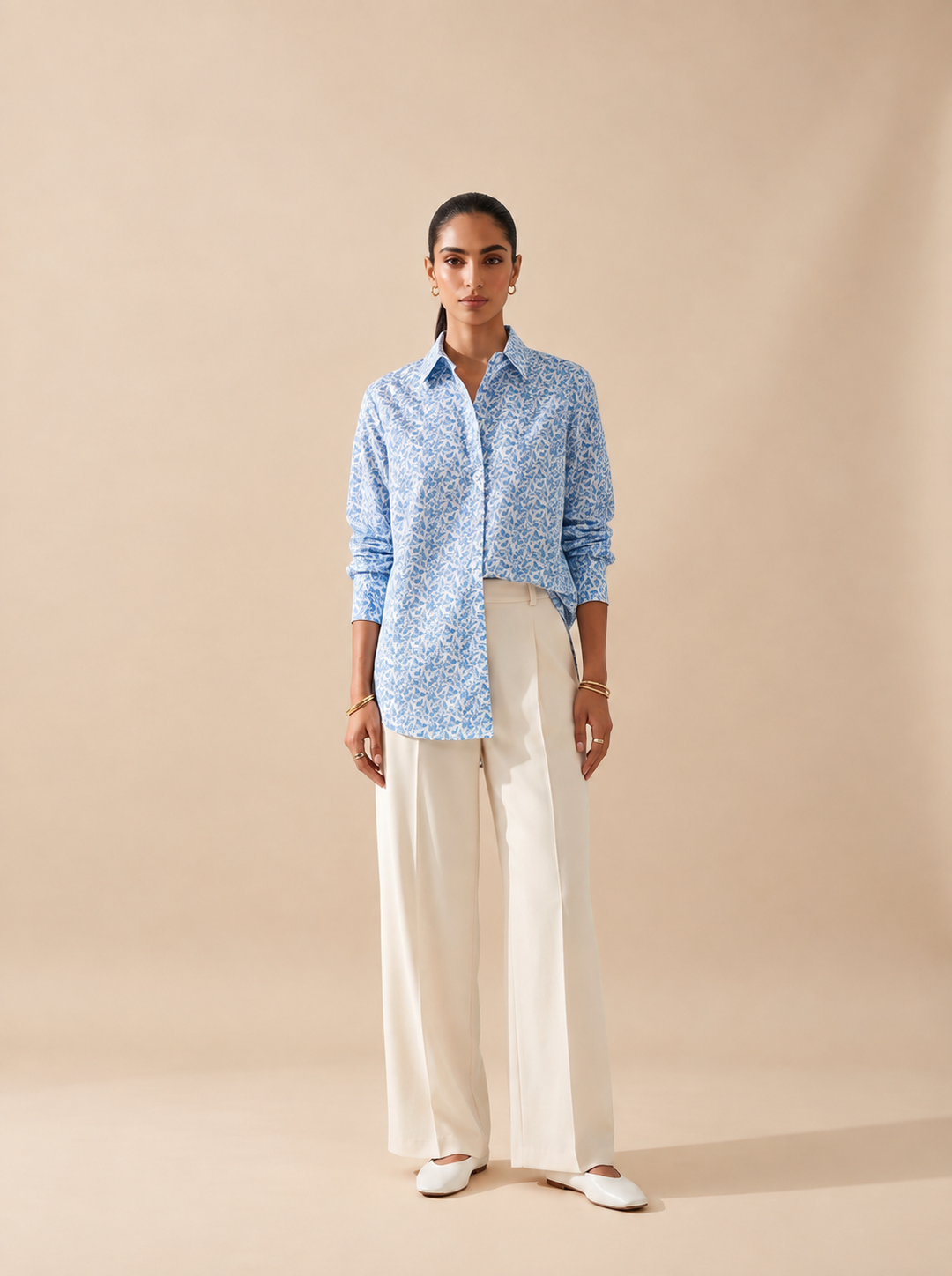Shop this blue geometric print women’s shirt in premium cotton. A breathable and comfortable button-down style for office, travel and everyday wear.
