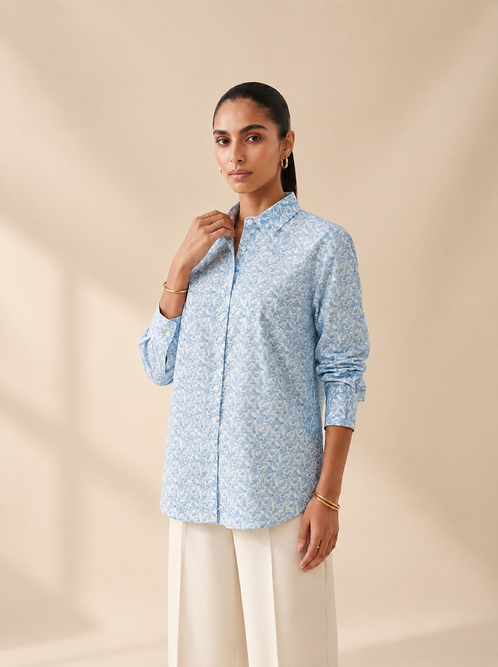 Shop this blue geometric print women’s shirt in premium cotton. A breathable and comfortable button-down style for office, travel and everyday wear.
