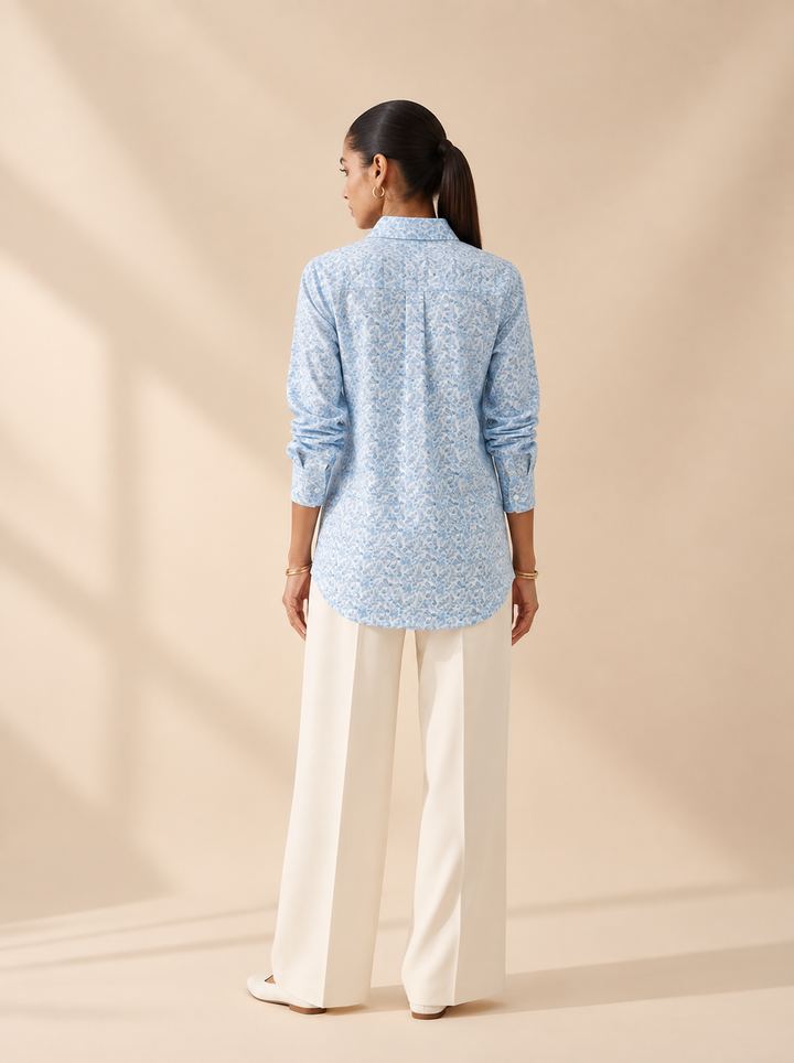 Shop this blue geometric print women’s shirt in premium cotton. A breathable and comfortable button-down style for office, travel and everyday wear.
