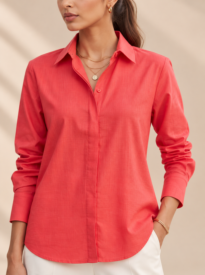 Shop the Coral Ease women’s shirt by Lush Layers, crafted in premium-quality cotton with a relaxed fit and classic collar. An elegant choice for work and everyday wear.
Breathable cotton. Relaxed tailoring. Effortless colour.
A versatile coral cotton shirt designed to take you comfortably from workdays to weekends.