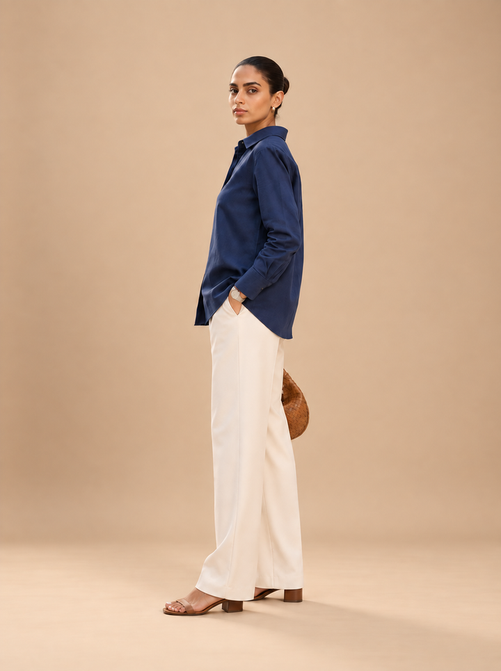 Shop the Navy Ease women’s shirt by Lush Layers, crafted in premium cotton with a comfortable 27-inch length. A versatile choice for office, everyday and smart-casual dressing
Clean. Comfortable. Effortlessly polished.
A navy blue shirt crafted in premium cotton with a relaxed silhouette and classic styling—an easy wardrobe essential for workdays and beyond.