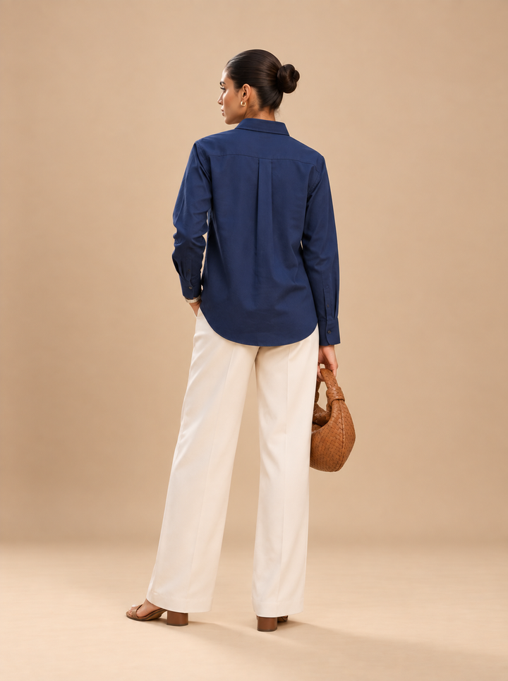 Shop the Navy Ease women’s shirt by Lush Layers, crafted in premium cotton with a comfortable 27-inch length. A versatile choice for office, everyday and smart-casual dressing
Clean. Comfortable. Effortlessly polished.
A navy blue shirt crafted in premium cotton with a relaxed silhouette and classic styling—an easy wardrobe essential for workdays and beyond.