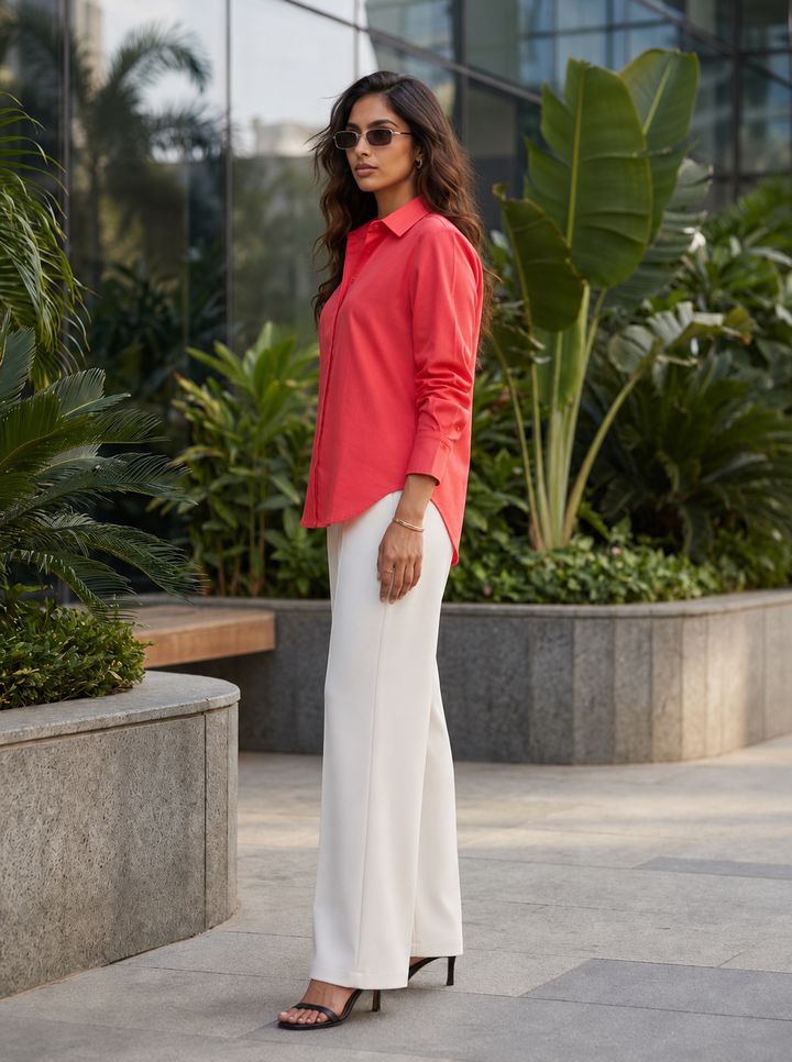 Shop the Coral Ease women’s shirt by Lush Layers, crafted in premium-quality cotton with a relaxed fit and classic collar. An elegant choice for work and everyday wear.
Breathable cotton. Relaxed tailoring. Effortless colour.
A versatile coral cotton shirt designed to take you comfortably from workdays to weekends.