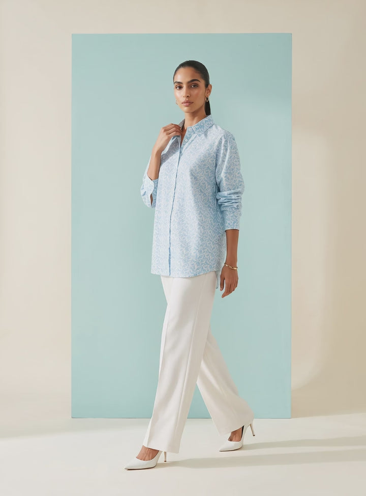 Shop this blue geometric print women’s shirt in premium cotton. A breathable and comfortable button-down style for office, travel and everyday wear.
